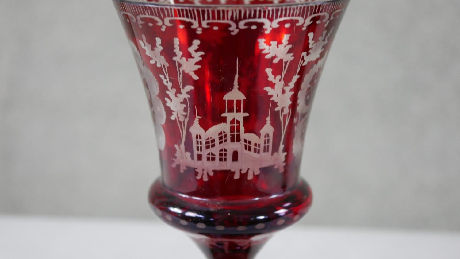 Two early 20th century Bohemian ruby cut to clear glass engraved goblets. One decorated with - Image 3 of 6