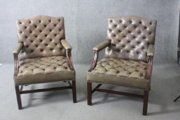 A pair of vintage Gainsborough style library armchairs in deep buttoned and studded leather
