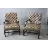 A pair of vintage Gainsborough style library armchairs in deep buttoned and studded leather