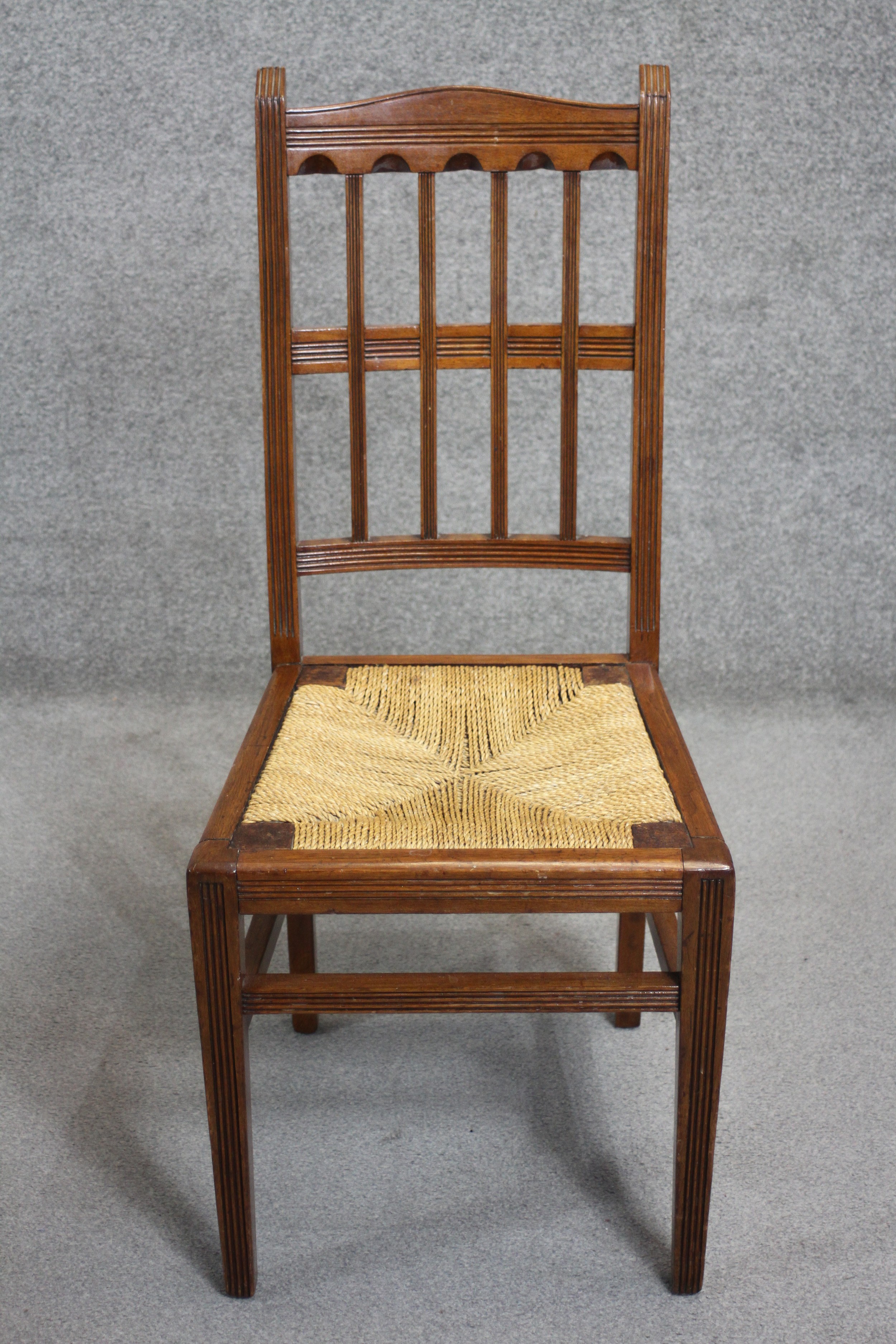 A set of four late 19th century mahogany dining chairs with drop in woven rush seats on square - Image 2 of 4