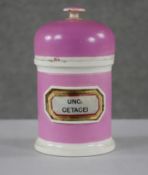 A 19th century York Glass Company, England pink ceramic lidded apothecary jar with gilded glass