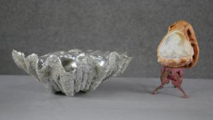 A carved vintage conch shell light with a female portrait and flower decoration on a gilt metal
