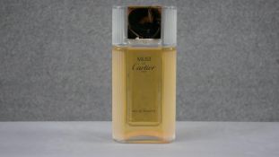 A large shop display perfume bottle Must de Cartier. (damaged) H.30 W.14 D.6cm
