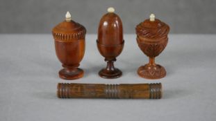Three 19th century fruitwood and bone urn design thimble holders along with a needle case. H.9 W.1.