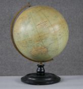 An early 20th century Philips' 12" Terrestrial Globe on ebony stand, no.2615, showing 'Principal