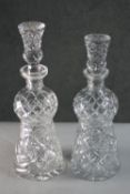 A pair of hand cut crystal thistle shape decanters with stoppers. H.33 Diam.10 cm.