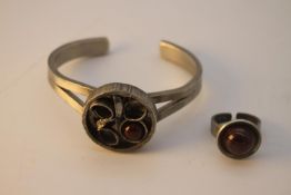 A Lysgaard Danish mid-century pewter and glazed ceramic dress ring and abstract design bangle.
