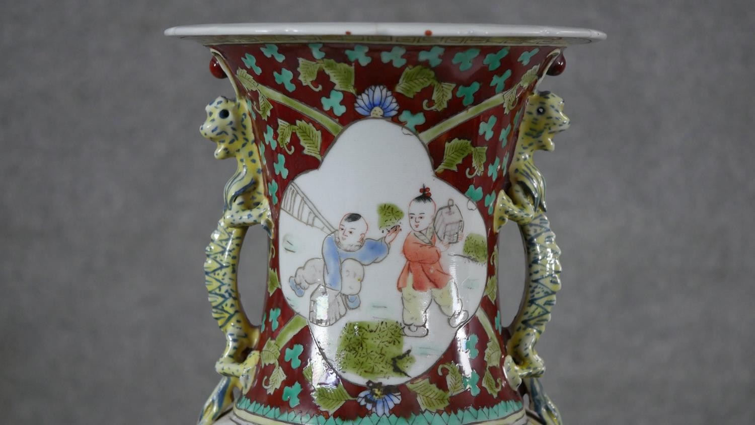 A large 19th century Chinese porcelain hand painted twin handled vase on carved harwood stand. The - Image 2 of 9