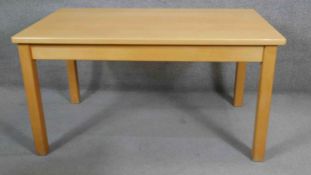 A contemporary light oak dining table by Philip Bastow of Reeth. H.74 W.140 D.85cm