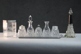 A collection of early 20th century cut glass. Including a silver topped engraved floral design