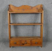 A set of pine open kitchen shelves fitted with spice drawers. H.91 W.67 D.14cm