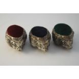 Three novelty Danish silver hedgehog pin cushions. With green, maroon and navy blue cushions.