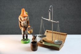 A vintage German painted hardwood nutcracker as a mushroom collector with fur detailing and moving