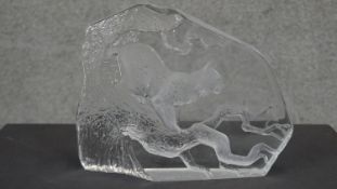 Mats Jonasson- A reverse cut crystal sculpture of a Lynx in a tree. H.29 W.24cm