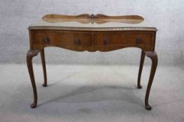A mid century burr walnut Epstein serving or console table fitted with frieze drawers on carved
