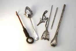 A collection of silver and silver plate. Including a mate straw, a silver darning needle, a copper