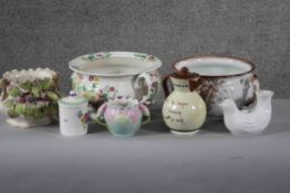 A collection of seven porcelain and ceramic pieces. Including a Torquay ware lidded jug, two