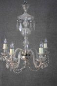 A large cut crystal and and cane glass five branch chandelier with hanging crystal drops and