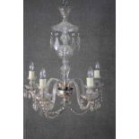 A large cut crystal and and cane glass five branch chandelier with hanging crystal drops and