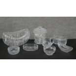 A collection of eight cut crystal pieces. Including a boat shaped crystal bowl, a lidded cut crystal