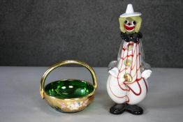 A Murano style glass clown figure (damage to hat) along with a gilded green glass basket. L.29 (