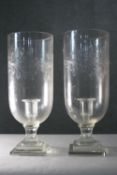 Two large Victorian foliate and floral engraved glass storm lantern candle holders. H.38 Diam. 15 cm