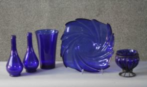 Five pieces of cobalt blue glass. Including two bottles, a blown glass and wire gourd shaped