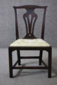 A Georgian mahogany dining chair with pierced vase shaped back above drop in seat on square