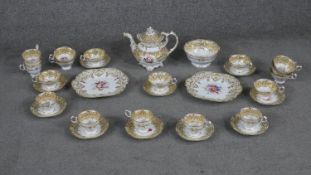 A part 19th century hand painted and gilded floral design ten person porcelain tea and coffee set.