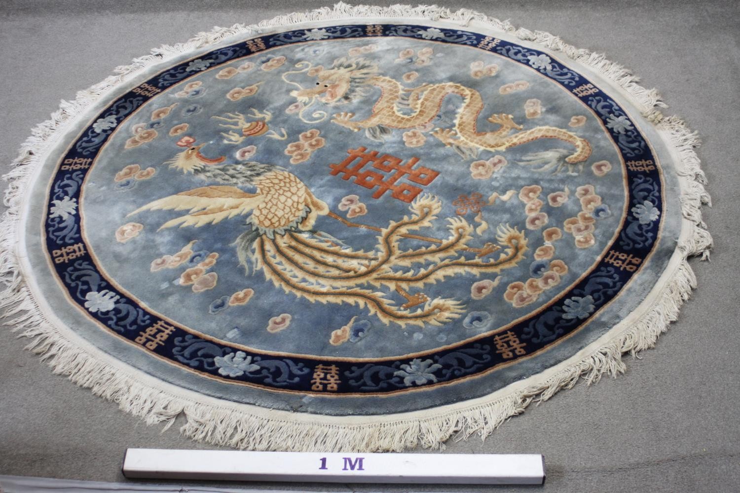 A Chinese carpet with chasing dragon and character motifs on a powder blue ground within a - Image 8 of 8