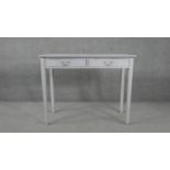 A 19th century distressed painted side table with two frieze drawers on square tapering supports.