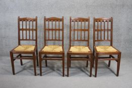 A set of four late 19th century mahogany dining chairs with drop in woven rush seats on square
