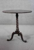 A 19th century mahogany occasional table on spiral twist cabriole supports. H.70 Diam. 62 cm