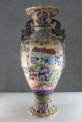 A large Japanese Meji period moriage Satsuma hand painted vase. With twin handles decorated with a