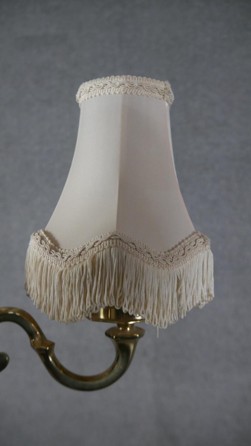 A set of four brass two branch scrolling design wall lights with cream silk shades and tassel - Image 3 of 4