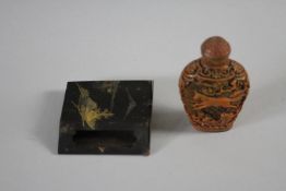 A 20th century Chinese carved resin snuff bottle with horse design along with a Japanese Damascene