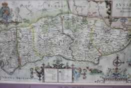 After John Norden- A framed and glazed 17th century hand coloured engraved map of Sussex by