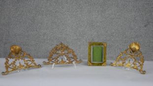 Three pierced gilt metal brackets, one with shell motif along with a velvet and gilt metal easel