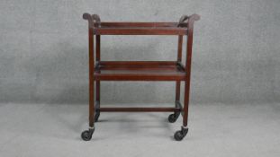 A vintage mahogany two tier trolley on wheel casters. H.87 W.75 D.40cm