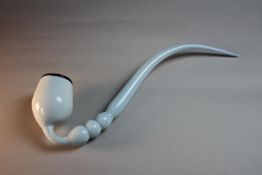 A late 19th century blown opaque glass bubble pipe. L.44 W.15cm.