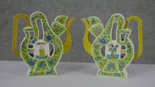 A pair of late 19th/early 20th century Chinese porcelain puzzle teapots and covers, decorated in