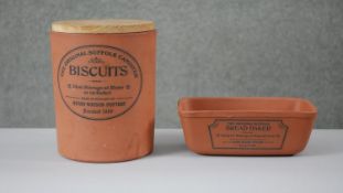 Two pieces of Henry Watson terracotta pottery, one storage jar with a wooden lid and a bread