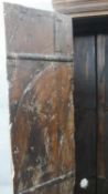 An Eastern teak carved and metal bound hall cupboard by India Jane. H.183 W.85 D.39cm