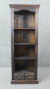 A contemporary 19th century style stained pine full height open bookcase. H.78 W.65 D.35cm