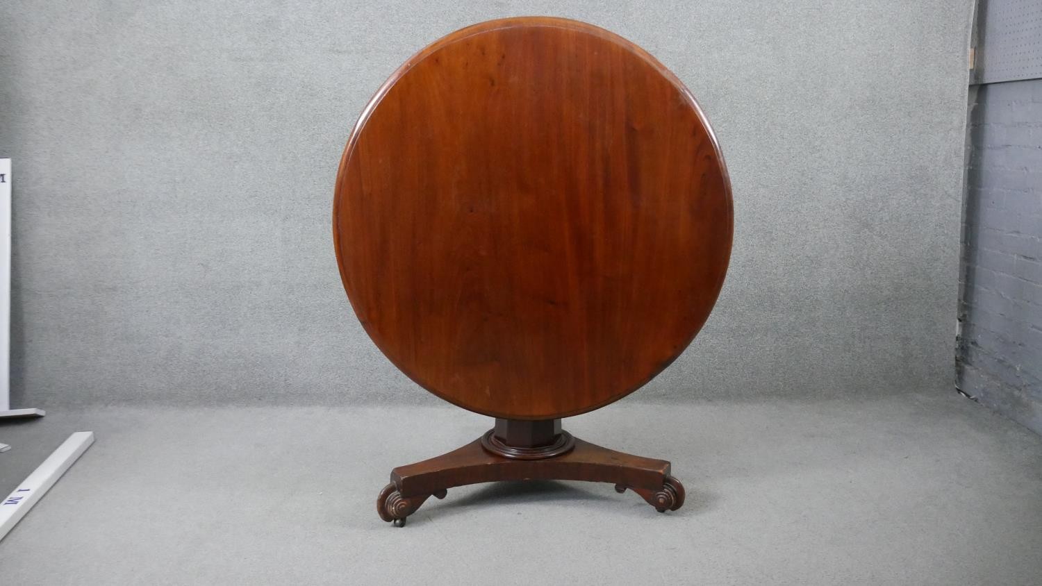 A 19th century mahogany tilt top dining table on faceted triform platform base. H.70 Diam.103cm - Image 5 of 5