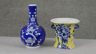 Two Chinese hand painted vases. One with prunus blossom decoration, the other with yellow ground and