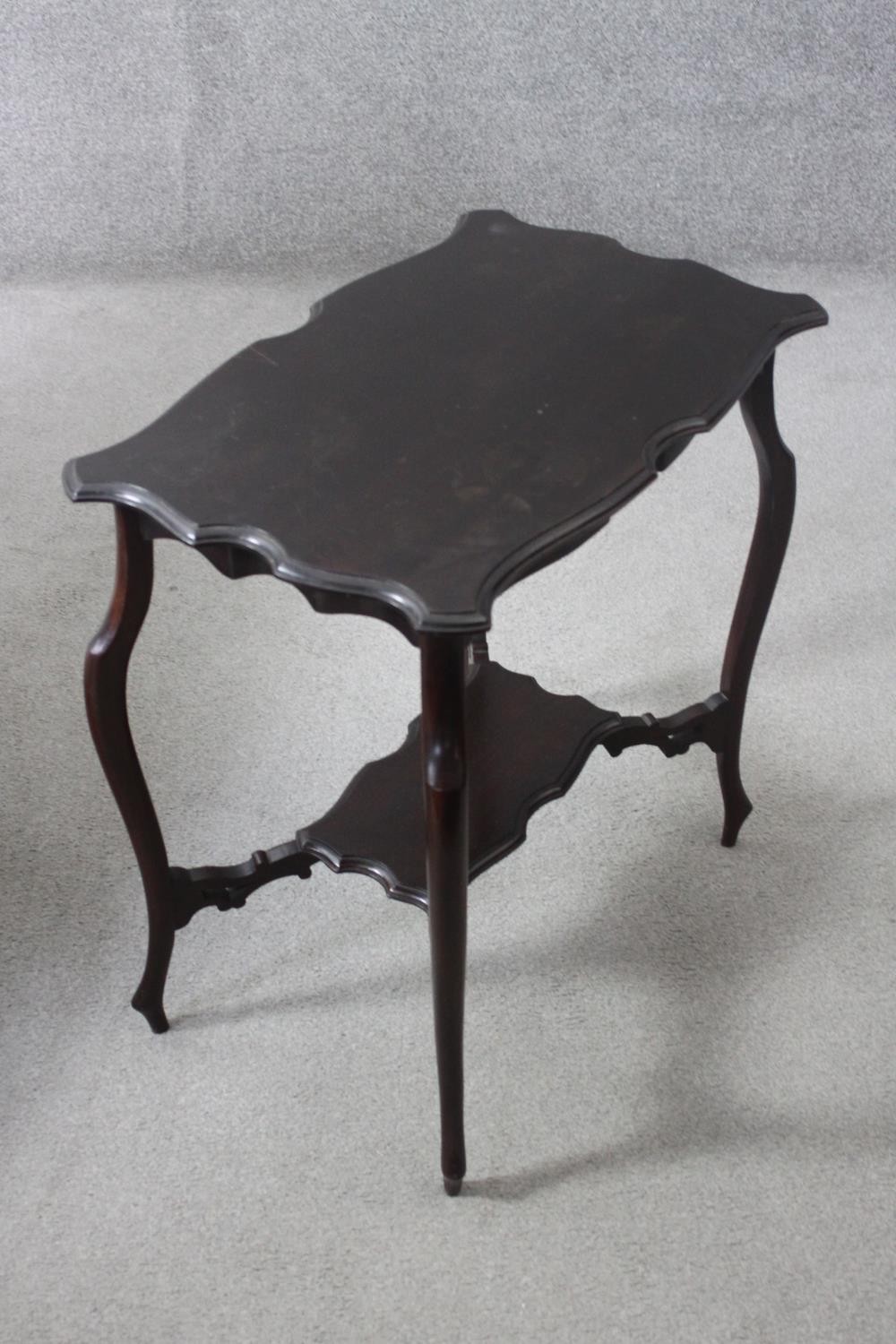 A C.1900 shaped top occasional table on cabriole supports united by under tier. H.67 W.64 D.41 cm. - Image 4 of 5