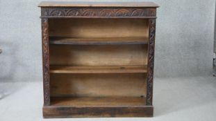 An early 20th century carved oak open bookcase in the country antique style. H.108 W.107 D.30cm