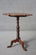 A 19th century mahogany tilt top occasional table on turned cabriole tripod base. H.70 W.58 D.36cm