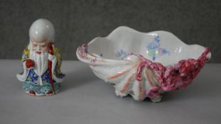 Two pieces of porcelain. Including a Chinese hand painted figure of Shou Xing along with a shell